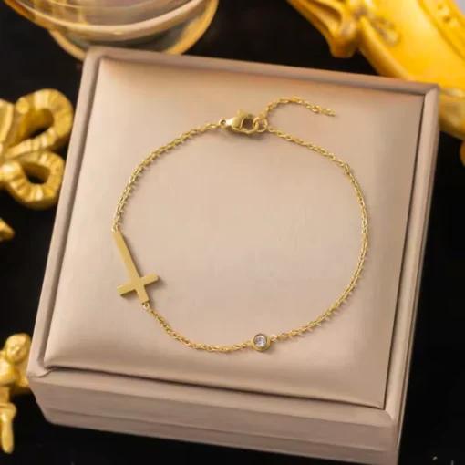 Pulsera cruz dorada Célia