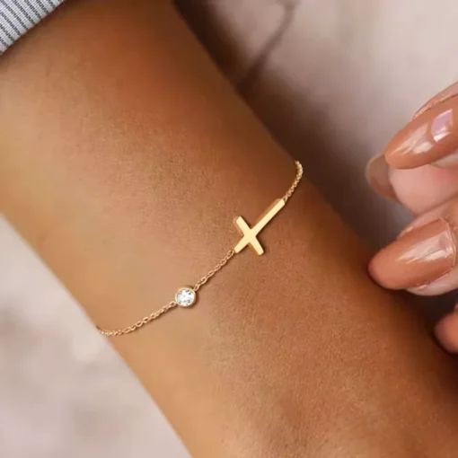 Pulsera cruz dorada Célia